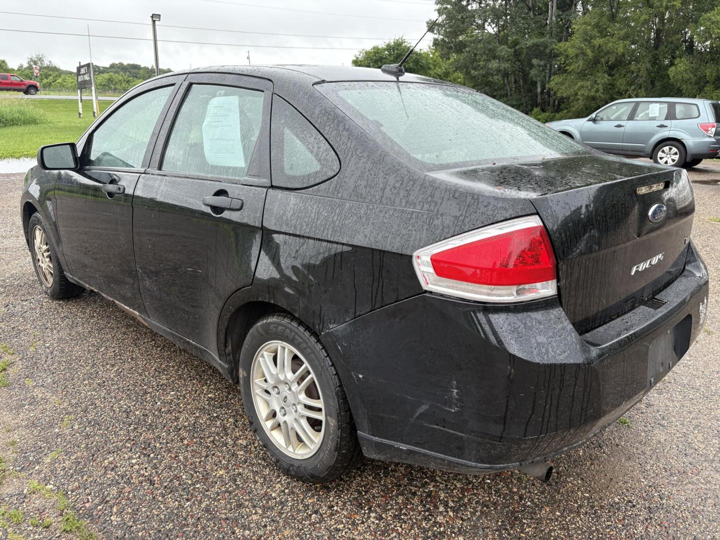 2010 Black Ford Focus SE Sedan (1FAHP3FN0AW) with an 2.0L L4 DOHC 16V engine, located at 17255 hwy 65 NE, Ham Lake, MN, 55304, 0.000000, 0.000000 - Photo#2