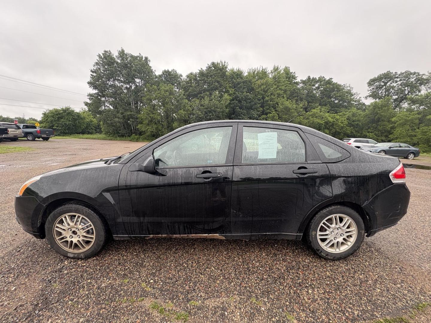 2010 Black Ford Focus SE Sedan (1FAHP3FN0AW) with an 2.0L L4 DOHC 16V engine, located at 17255 hwy 65 NE, Ham Lake, MN, 55304, 0.000000, 0.000000 - Photo#1