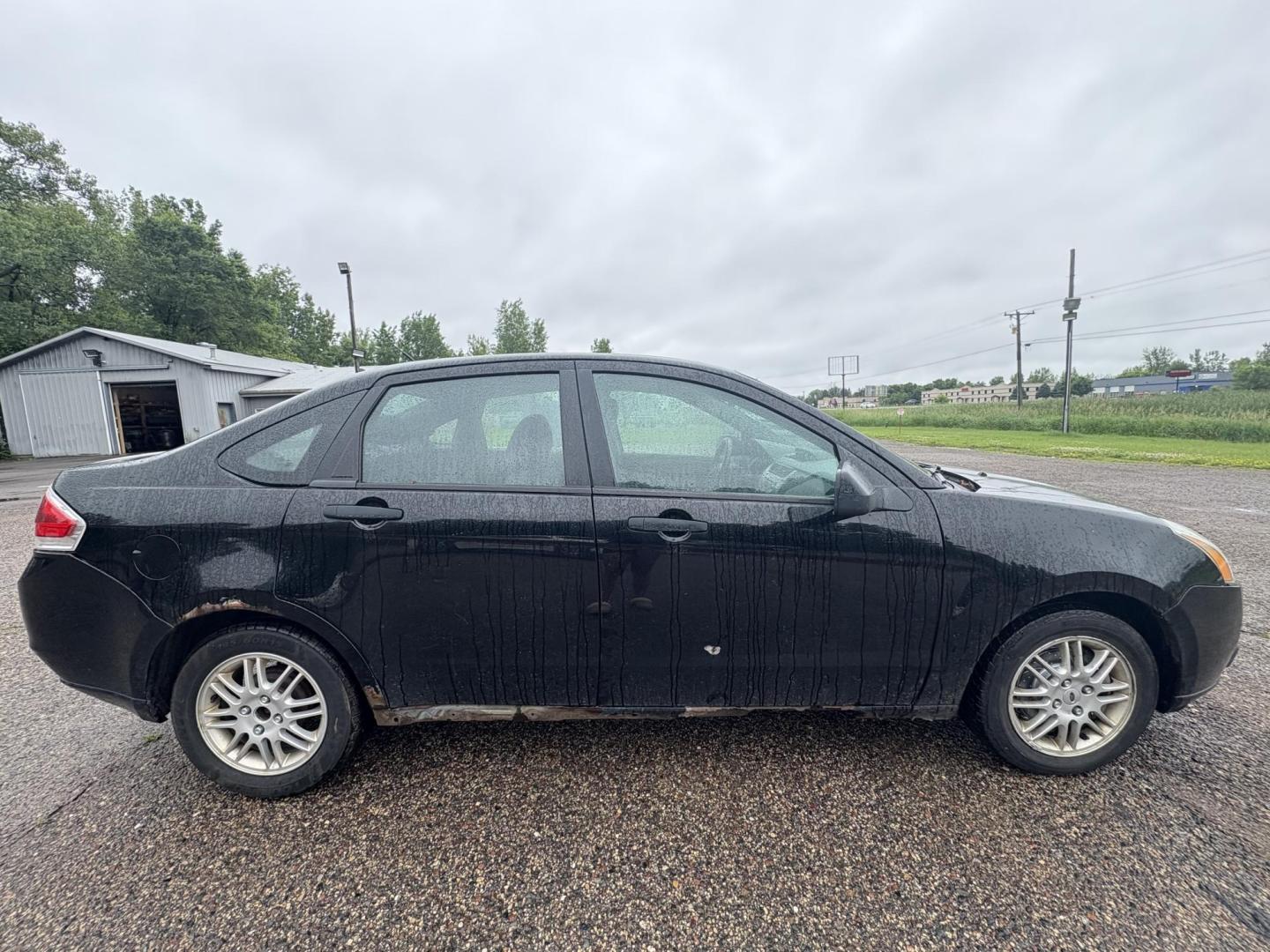 2010 Black Ford Focus SE Sedan (1FAHP3FN0AW) with an 2.0L L4 DOHC 16V engine, located at 17255 hwy 65 NE, Ham Lake, MN, 55304, 0.000000, 0.000000 - Photo#5