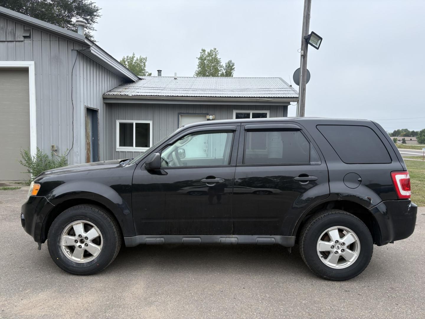 2011 Black Ford Escape XLS 4WD AT (1FMCU9C77BK) with an 2.5L L4 DOHC 16V engine, 6-Speed Automatic transmission, located at 17255 hwy 65 NE, Ham Lake, MN, 55304, 0.000000, 0.000000- Photo#1