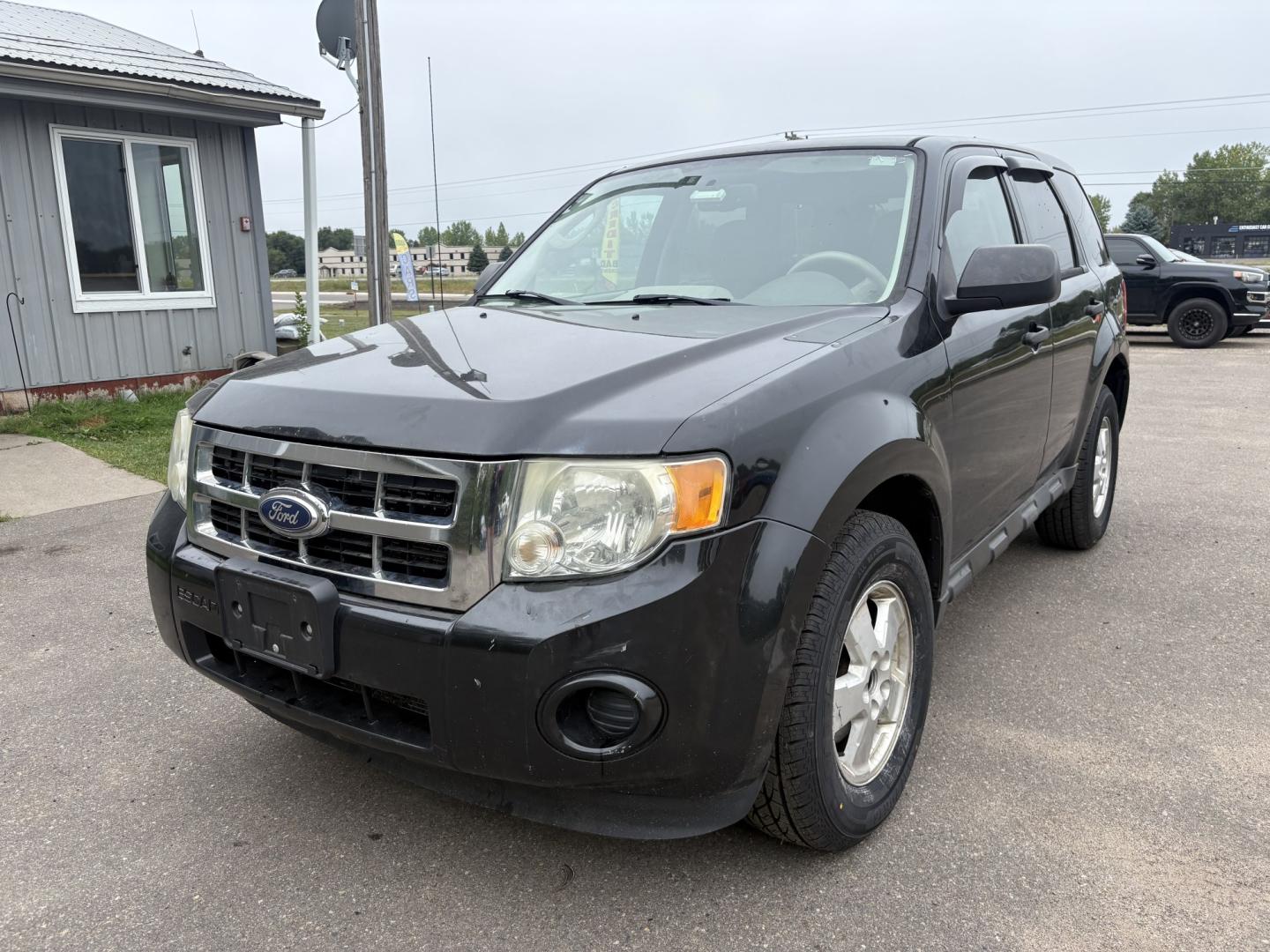 2011 Black Ford Escape XLS 4WD AT (1FMCU9C77BK) with an 2.5L L4 DOHC 16V engine, 6-Speed Automatic transmission, located at 17255 hwy 65 NE, Ham Lake, MN, 55304, 0.000000, 0.000000- Photo#0