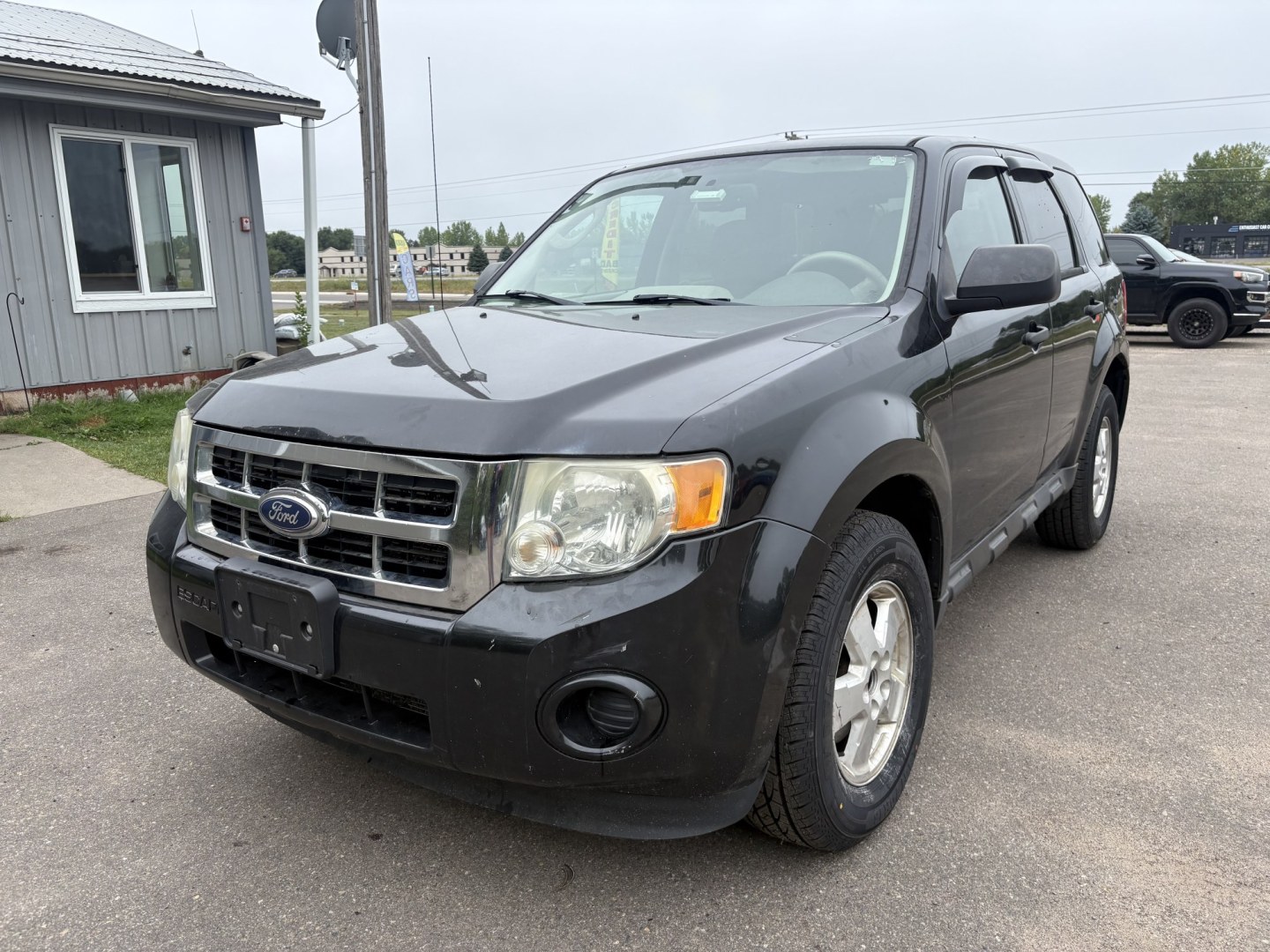 2011 Black Ford Escape XLS 4WD AT (1FMCU9C77BK) with an 2.5L L4 DOHC 16V engine, 6-Speed Automatic transmission, located at 17255 hwy 65 NE, Ham Lake, MN, 55304, 0.000000, 0.000000- Photo#0