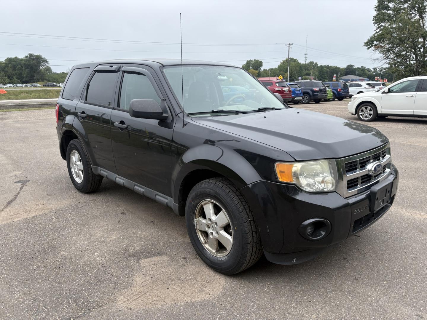 2011 Black Ford Escape XLS 4WD AT (1FMCU9C77BK) with an 2.5L L4 DOHC 16V engine, 6-Speed Automatic transmission, located at 17255 hwy 65 NE, Ham Lake, MN, 55304, 0.000000, 0.000000- Photo#6