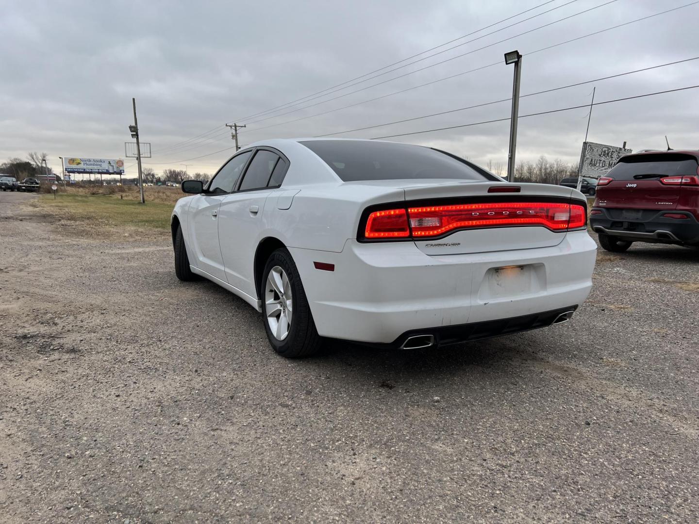 2014 White Dodge Charger SE (2C3CDXBG8EH) with an 3.6L V6 DOHC 24V engine, 5-Speed Automatic transmission, located at 17255 hwy 65 NE, Ham Lake, MN, 55304, 0.000000, 0.000000 - Photo#2
