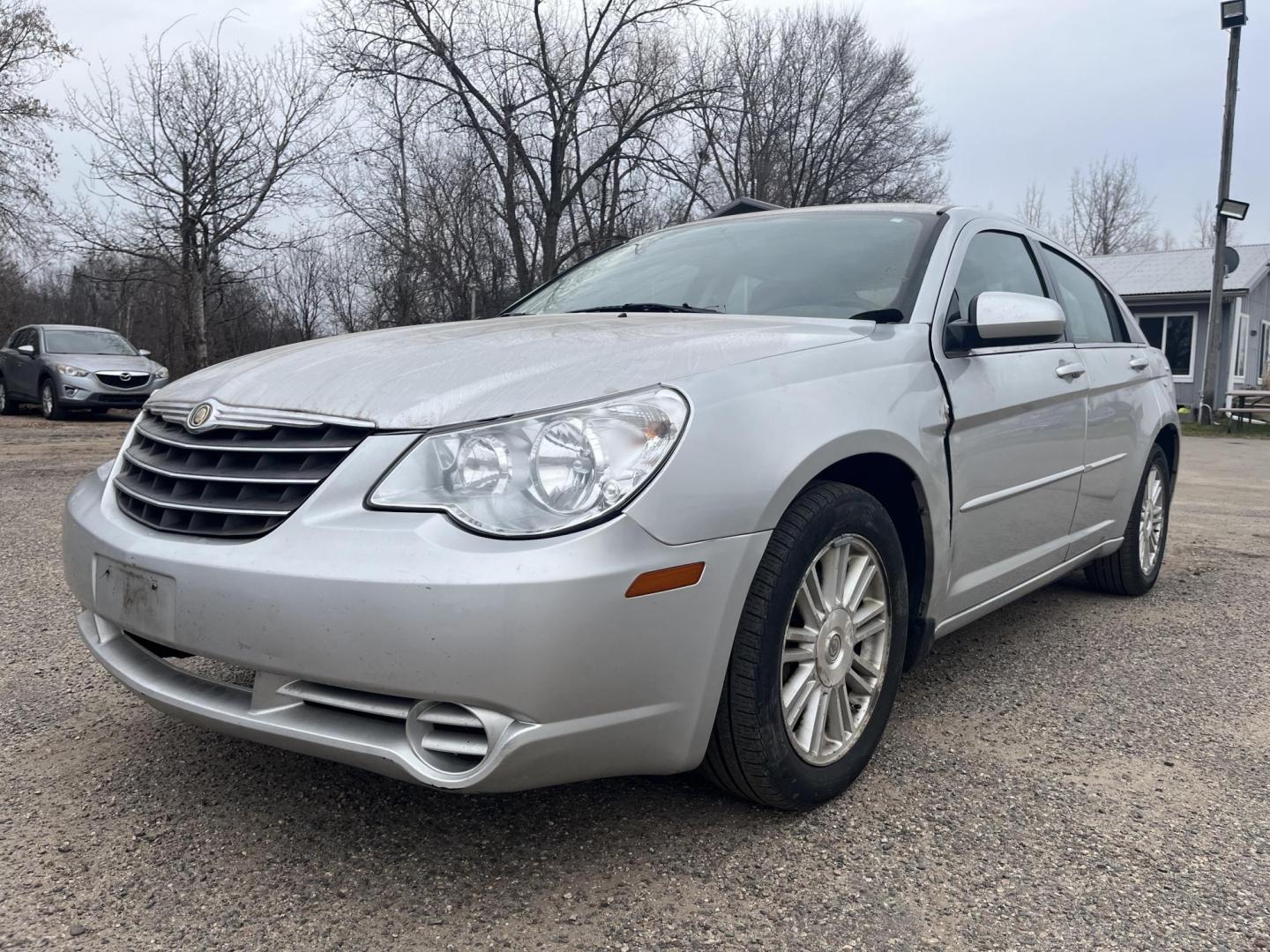 2007 silver Chrysler Sebring Touring (1C3LC56R57N) with an 2.7L V6 DOHC 24V FFV engine, 4-Speed Automatic Overdrive transmission, located at 17255 hwy 65 NE, Ham Lake, MN, 55304, 0.000000, 0.000000 - Photo#0