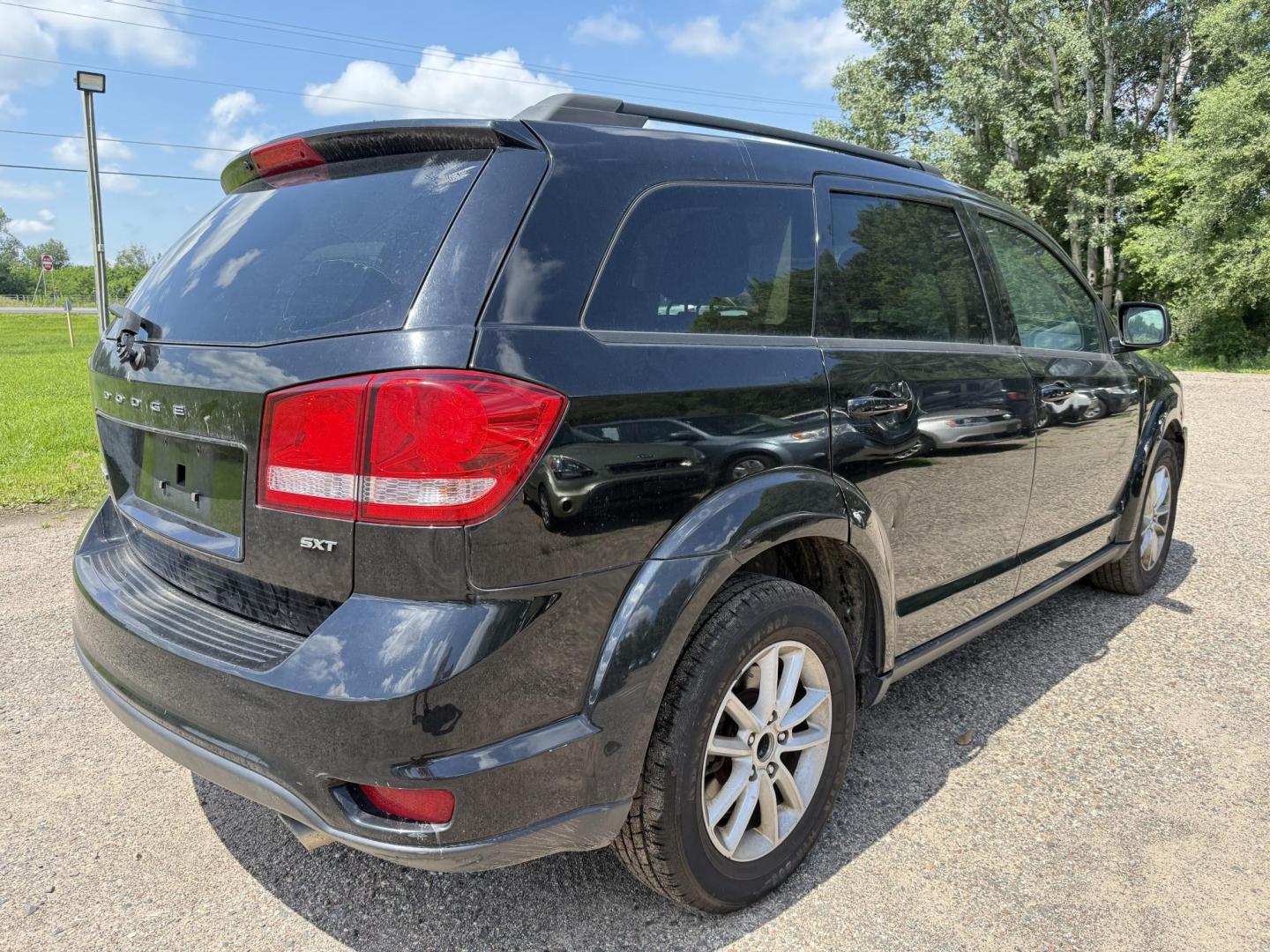 2014 Dodge Journey SXT (3C4PDCBG7ET) with an 3.6L V6 DOHC 24V engine, 6-Speed Automatic transmission, located at 17255 hwy 65 NE, Ham Lake, MN, 55304, 0.000000, 0.000000 - Photo#4