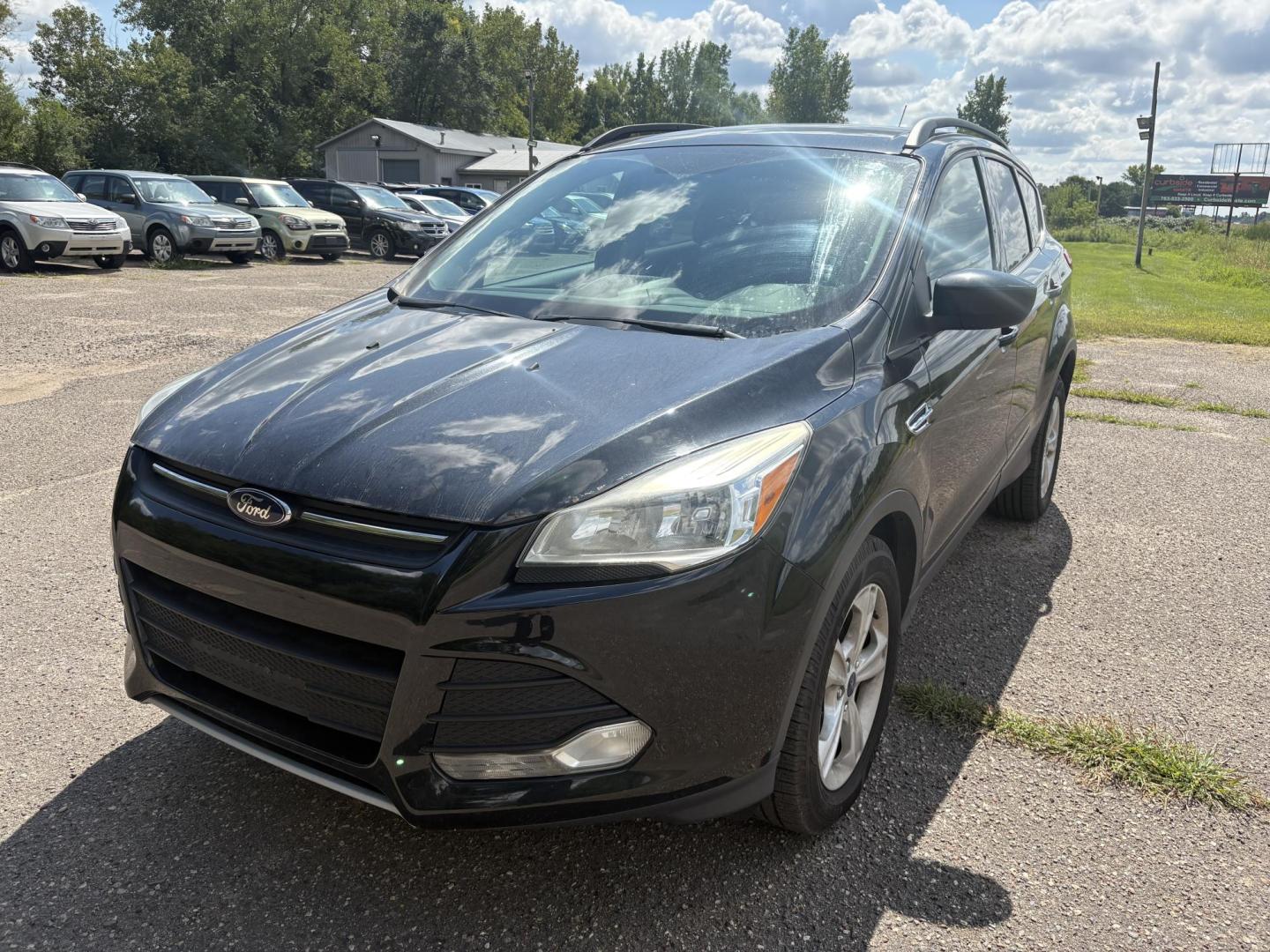 2014 Ford Escape SE FWD (1FMCU0GXXEU) with an 1.6L L4 DOHC 16V engine, 6-Speed Automatic transmission, located at 17255 hwy 65 NE, Ham Lake, MN, 55304, 0.000000, 0.000000 - Photo#0