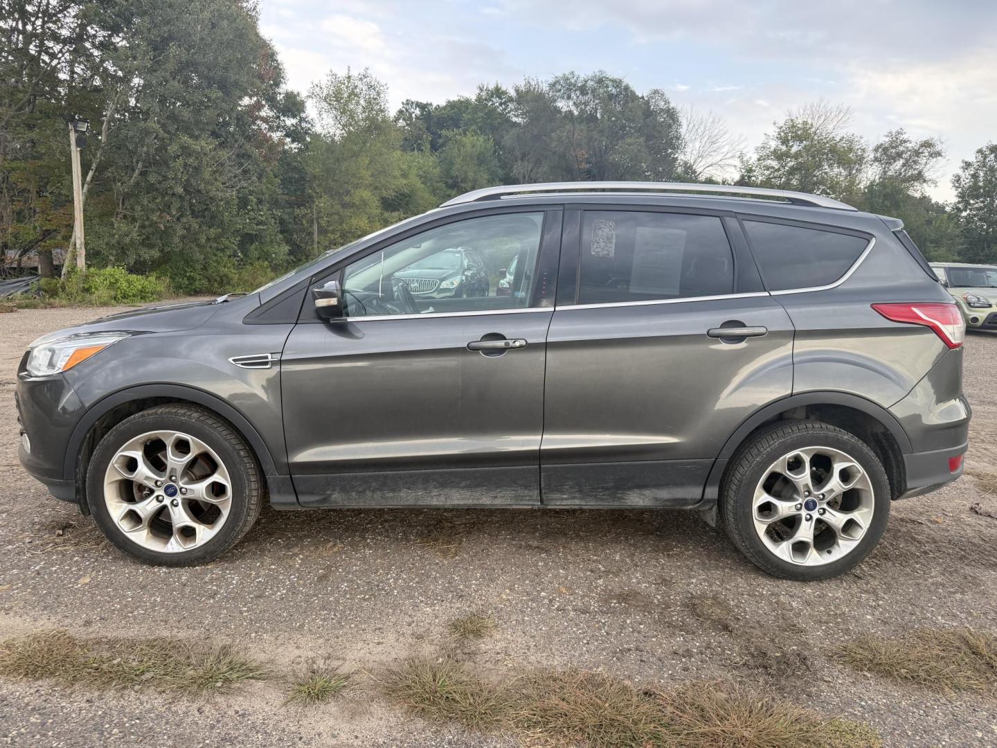 2015 Ford Escape Titanium 4WD (1FMCU9J94FU) with an 2.0L L4 DOHC 16V engine, 6-Speed Automatic transmission, located at 17255 hwy 65 NE, Ham Lake, MN, 55304, 0.000000, 0.000000 - Photo#1