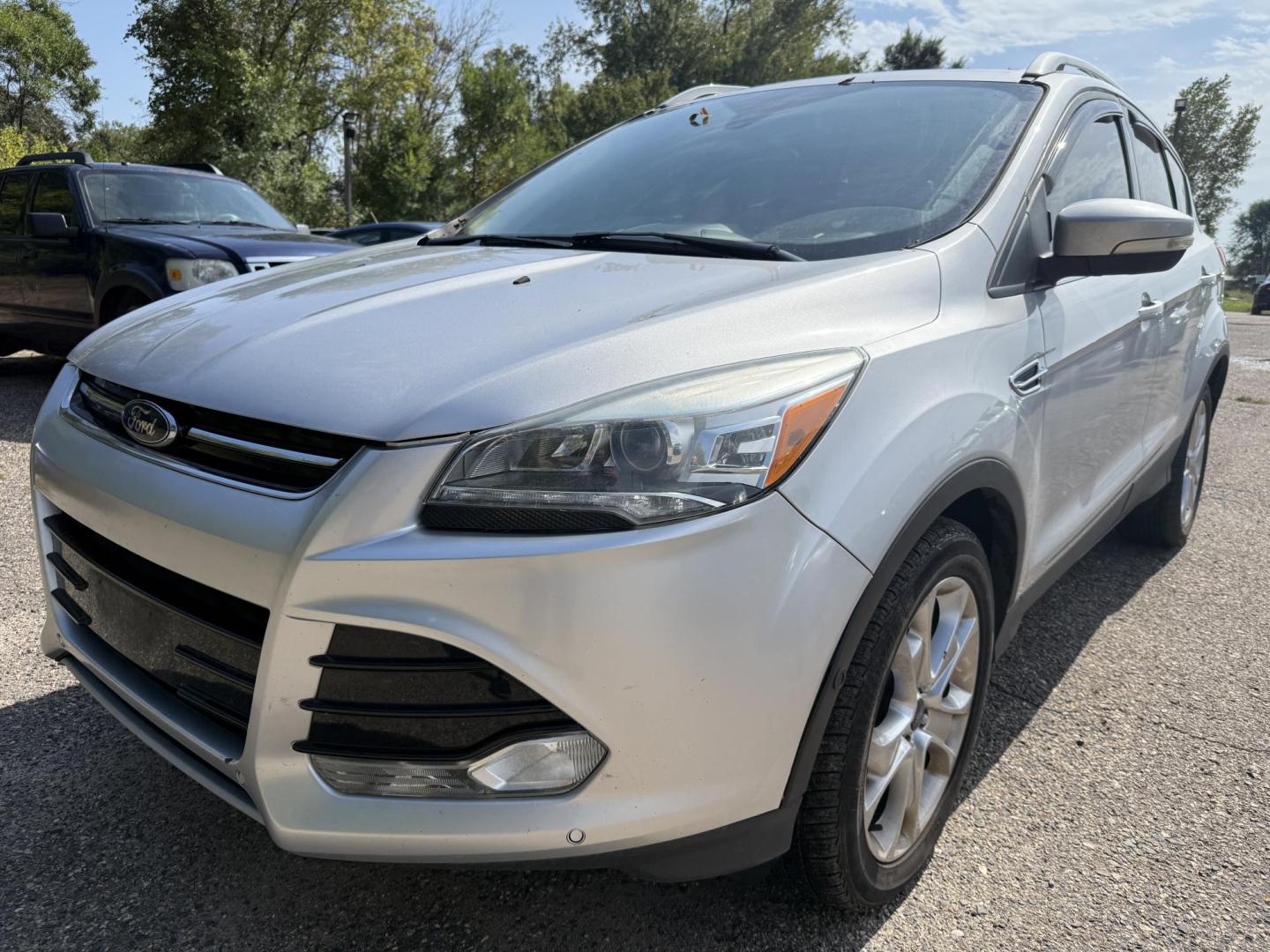 2016 Ford Escape Titanium FWD (1FMCU0JX0GU) with an 1.6L L4 DOHC 16V engine, 6-Speed Automatic transmission, located at 17255 hwy 65 NE, Ham Lake, MN, 55304, 0.000000, 0.000000 - Photo#0