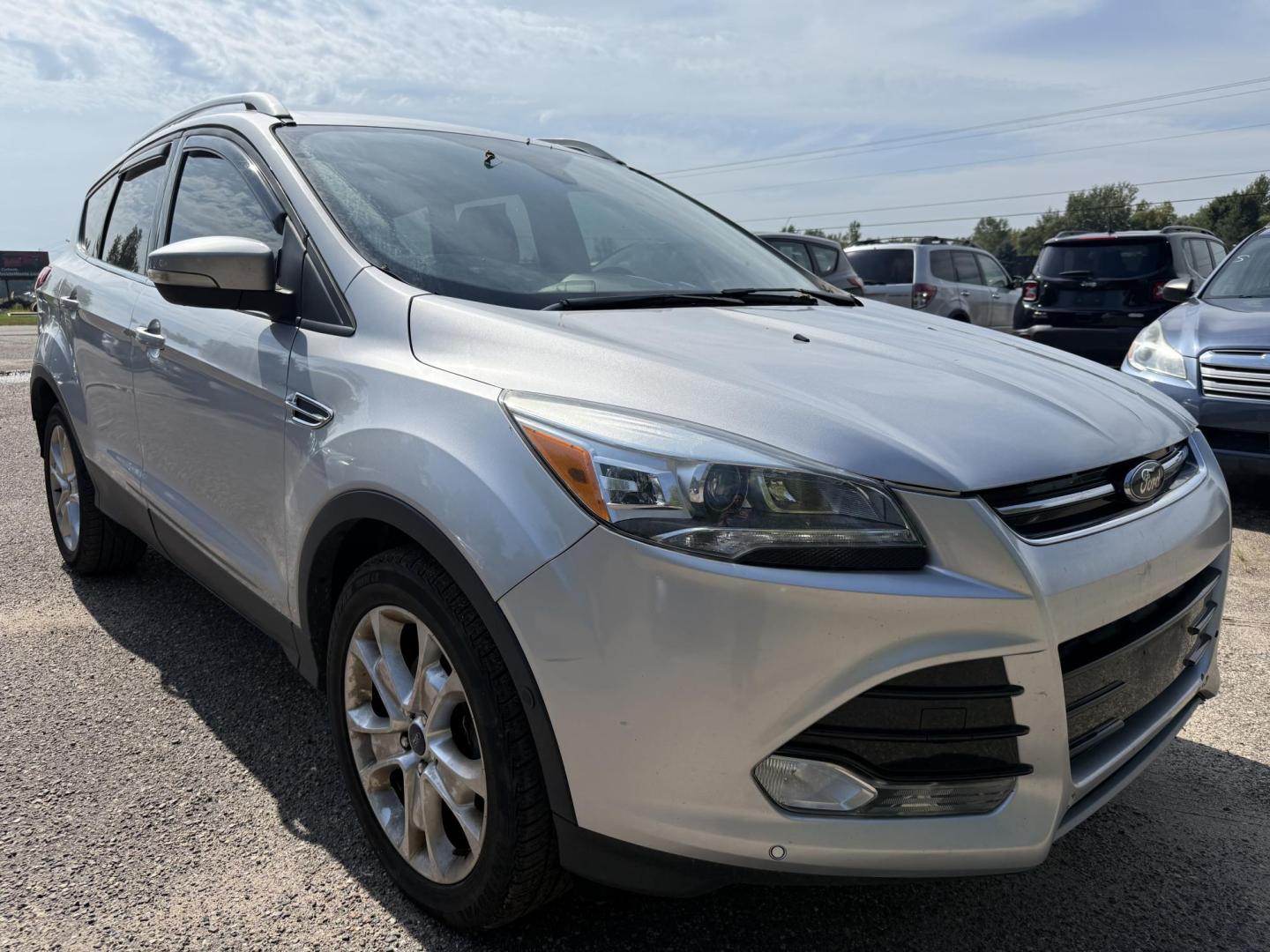 2016 Ford Escape Titanium FWD (1FMCU0JX0GU) with an 1.6L L4 DOHC 16V engine, 6-Speed Automatic transmission, located at 17255 hwy 65 NE, Ham Lake, MN, 55304, 0.000000, 0.000000 - Photo#6