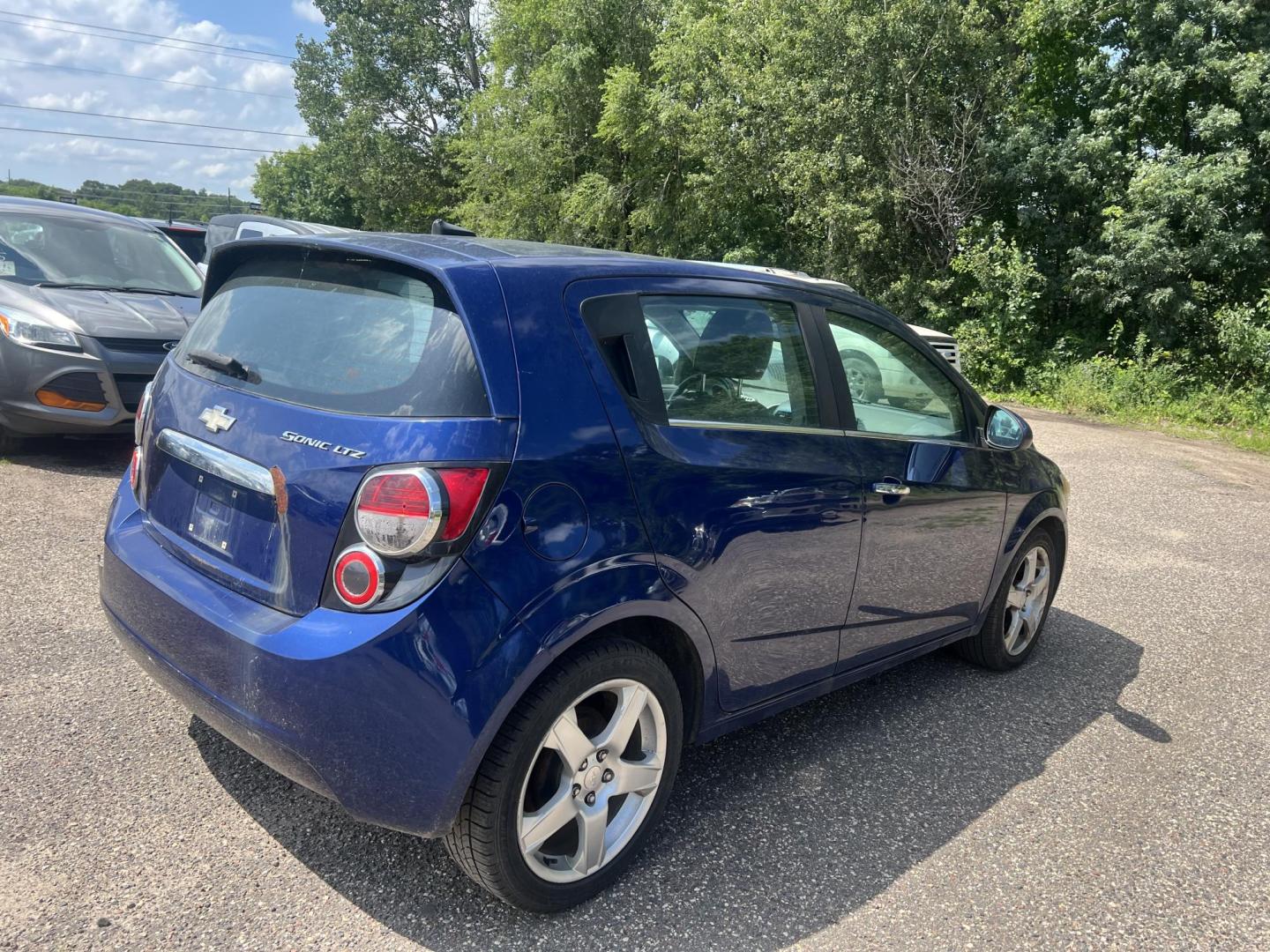 2013 Blue Chevrolet Sonic LTZ Auto 5-Door (1G1JE6SH9D4) with an 1.8L L4 DOHC 24V FFV engine, 6-Speed Automatic transmission, located at 17255 hwy 65 NE, Ham Lake, MN, 55304, 0.000000, 0.000000 - Photo#4