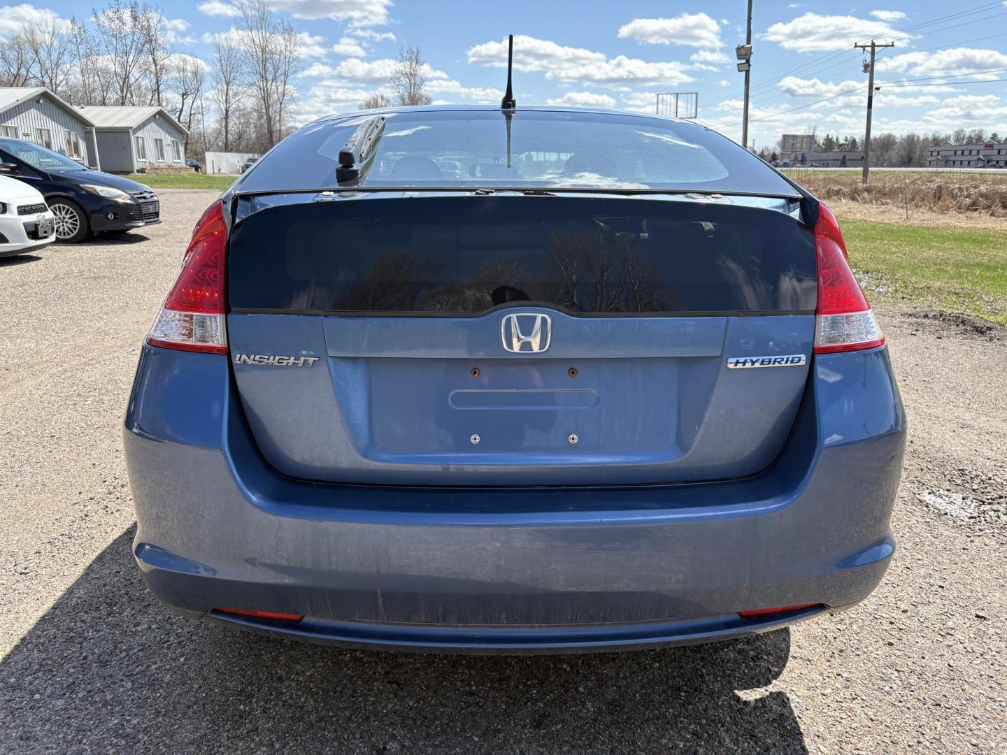 2010 Blue Honda Insight LX (JHMZE2H58AS) with an 1.3L L4 SOHC 8V HYBRID engine, Continuously Variable Transmisson transmission, located at 17255 hwy 65 NE, Ham Lake, MN, 55304, 0.000000, 0.000000 - Photo#3