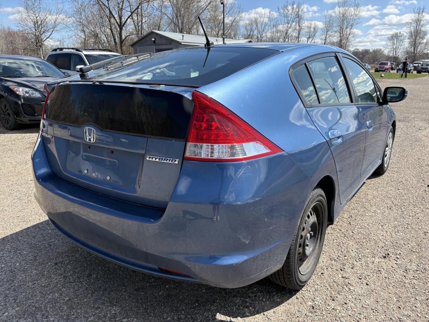 2010 Blue Honda Insight LX (JHMZE2H58AS) with an 1.3L L4 SOHC 8V HYBRID engine, Continuously Variable Transmisson transmission, located at 17255 hwy 65 NE, Ham Lake, MN, 55304, 0.000000, 0.000000 - Photo#4