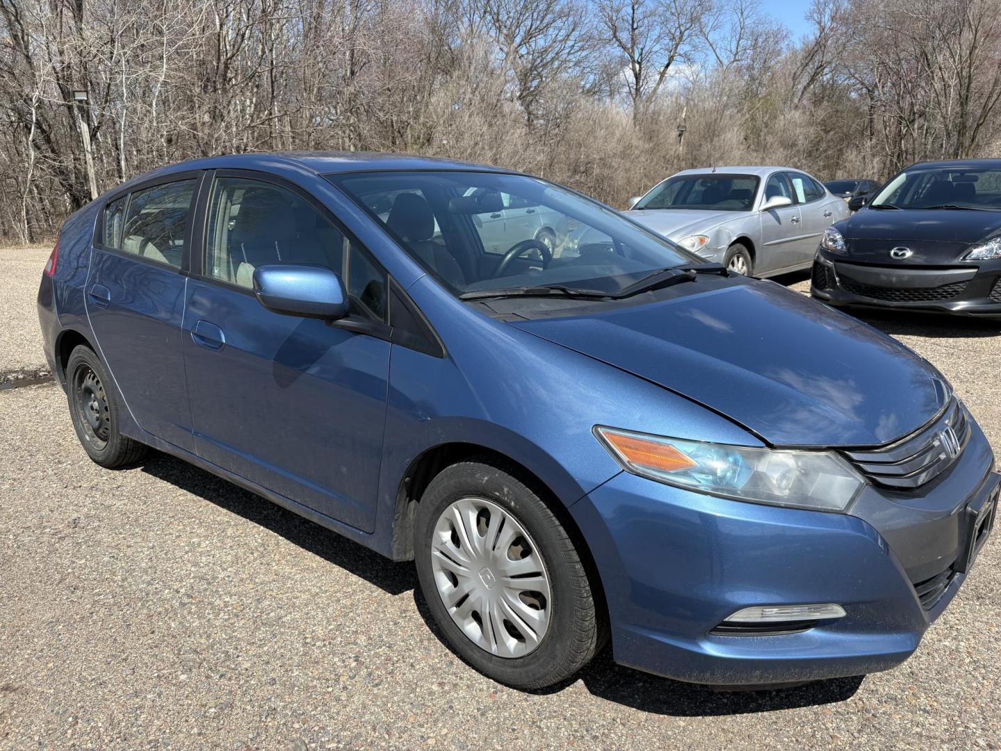2010 Blue Honda Insight LX (JHMZE2H58AS) with an 1.3L L4 SOHC 8V HYBRID engine, Continuously Variable Transmisson transmission, located at 17255 hwy 65 NE, Ham Lake, MN, 55304, 0.000000, 0.000000 - Photo#6