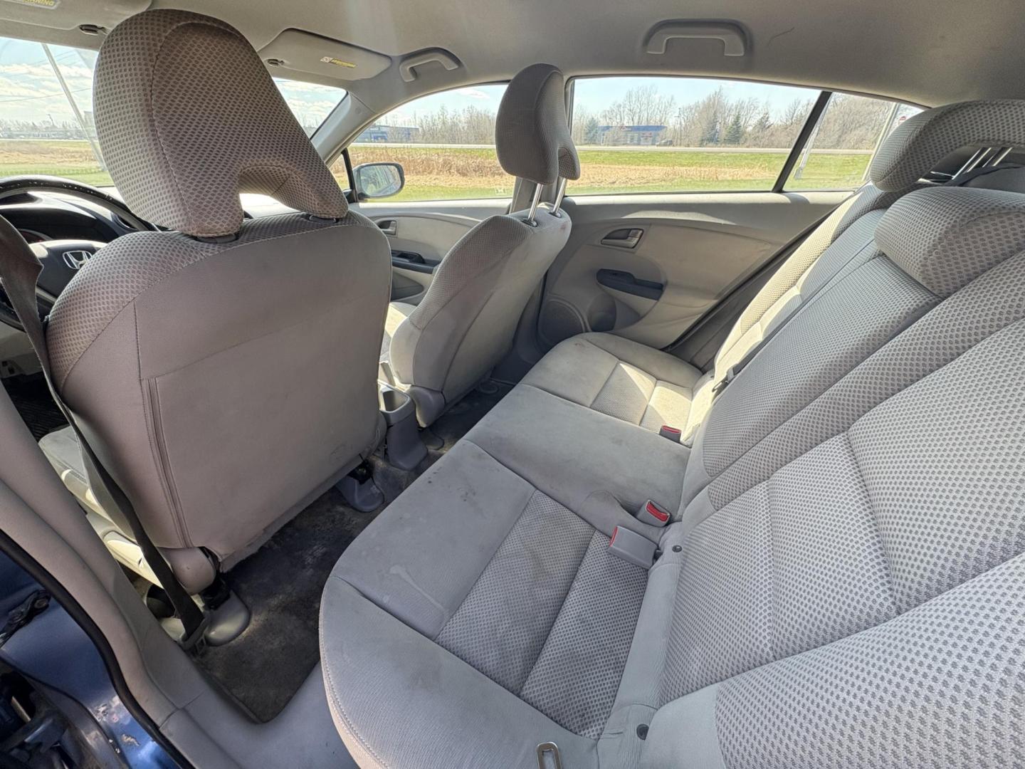 2010 Blue Honda Insight LX (JHMZE2H58AS) with an 1.3L L4 SOHC 8V HYBRID engine, Continuously Variable Transmisson transmission, located at 17255 hwy 65 NE, Ham Lake, MN, 55304, 0.000000, 0.000000 - Photo#11