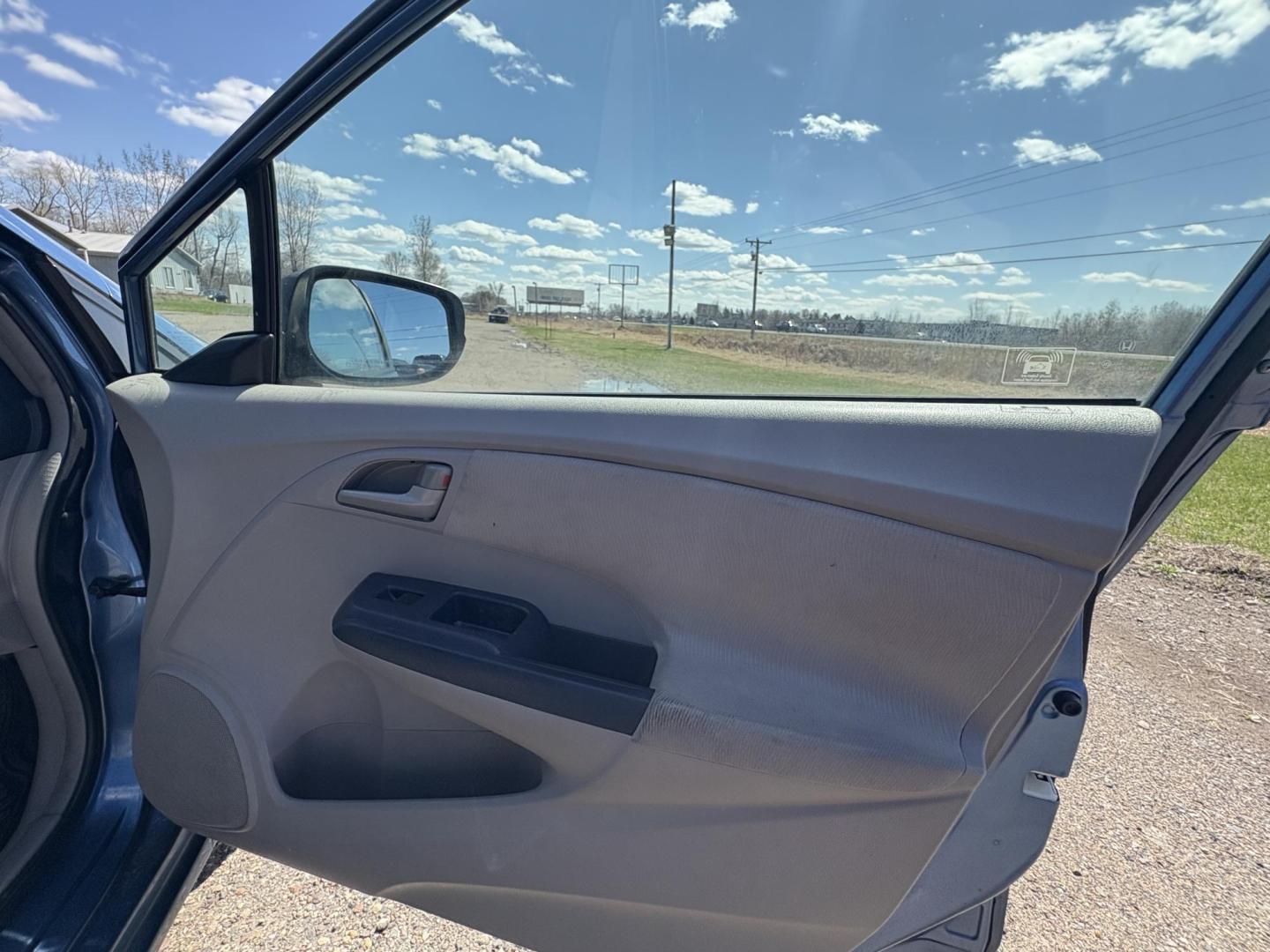 2010 Blue Honda Insight LX (JHMZE2H58AS) with an 1.3L L4 SOHC 8V HYBRID engine, Continuously Variable Transmisson transmission, located at 17255 hwy 65 NE, Ham Lake, MN, 55304, 0.000000, 0.000000 - Photo#14