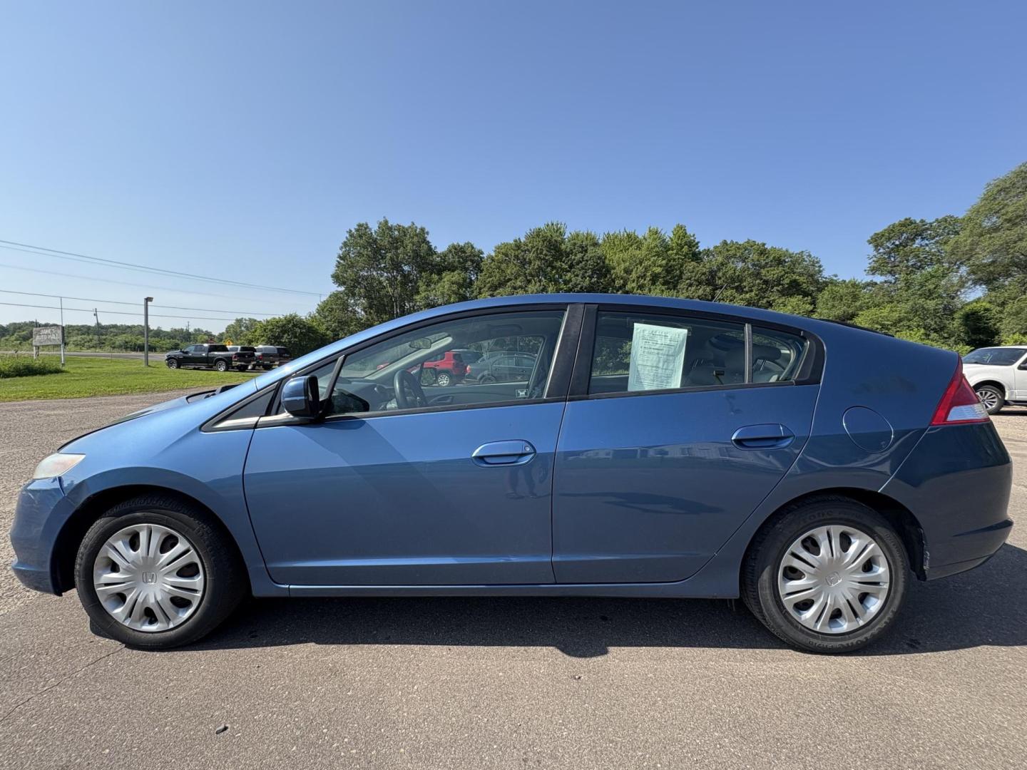 2010 Blue Honda Insight LX (JHMZE2H58AS) with an 1.3L L4 SOHC 8V HYBRID engine, Continuously Variable Transmisson transmission, located at 17255 hwy 65 NE, Ham Lake, MN, 55304, 0.000000, 0.000000 - Photo#1
