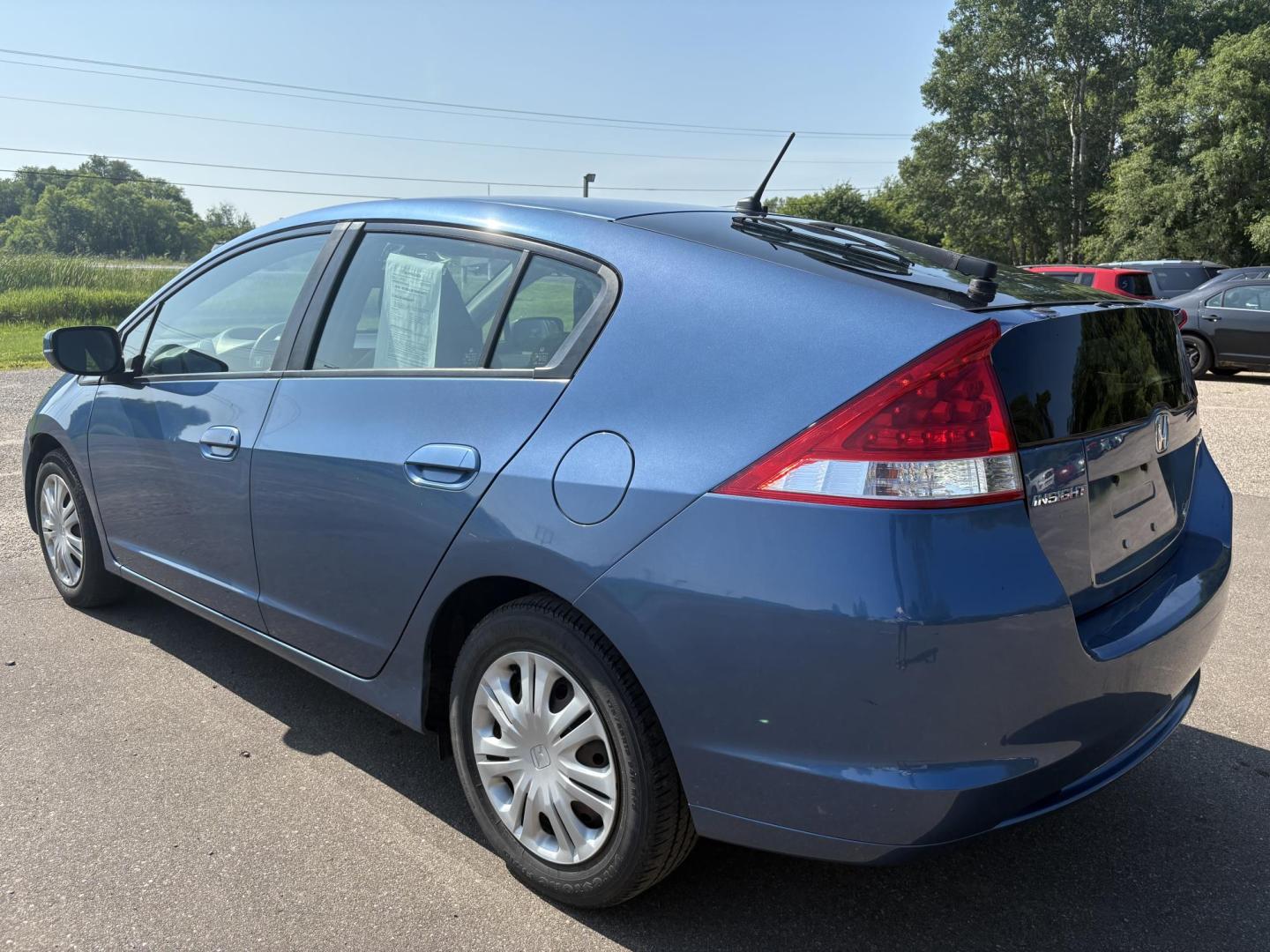 2010 Blue Honda Insight LX (JHMZE2H58AS) with an 1.3L L4 SOHC 8V HYBRID engine, Continuously Variable Transmisson transmission, located at 17255 hwy 65 NE, Ham Lake, MN, 55304, 0.000000, 0.000000 - Photo#2