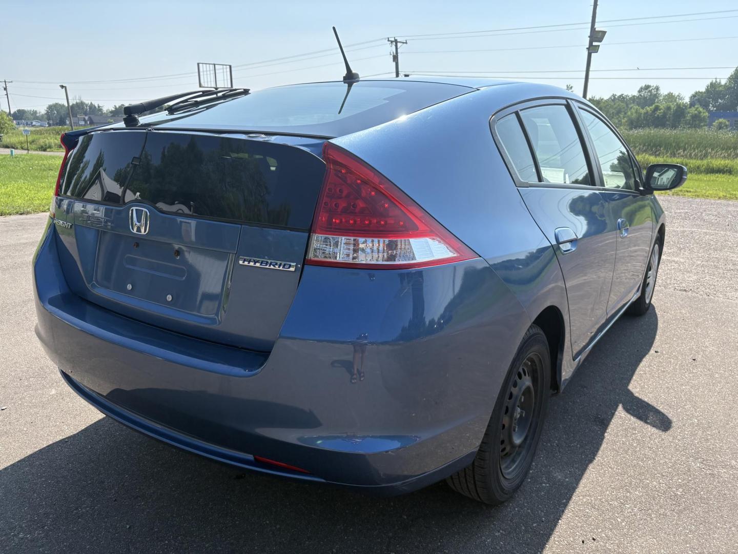 2010 Blue Honda Insight LX (JHMZE2H58AS) with an 1.3L L4 SOHC 8V HYBRID engine, Continuously Variable Transmisson transmission, located at 17255 hwy 65 NE, Ham Lake, MN, 55304, 0.000000, 0.000000 - Photo#4