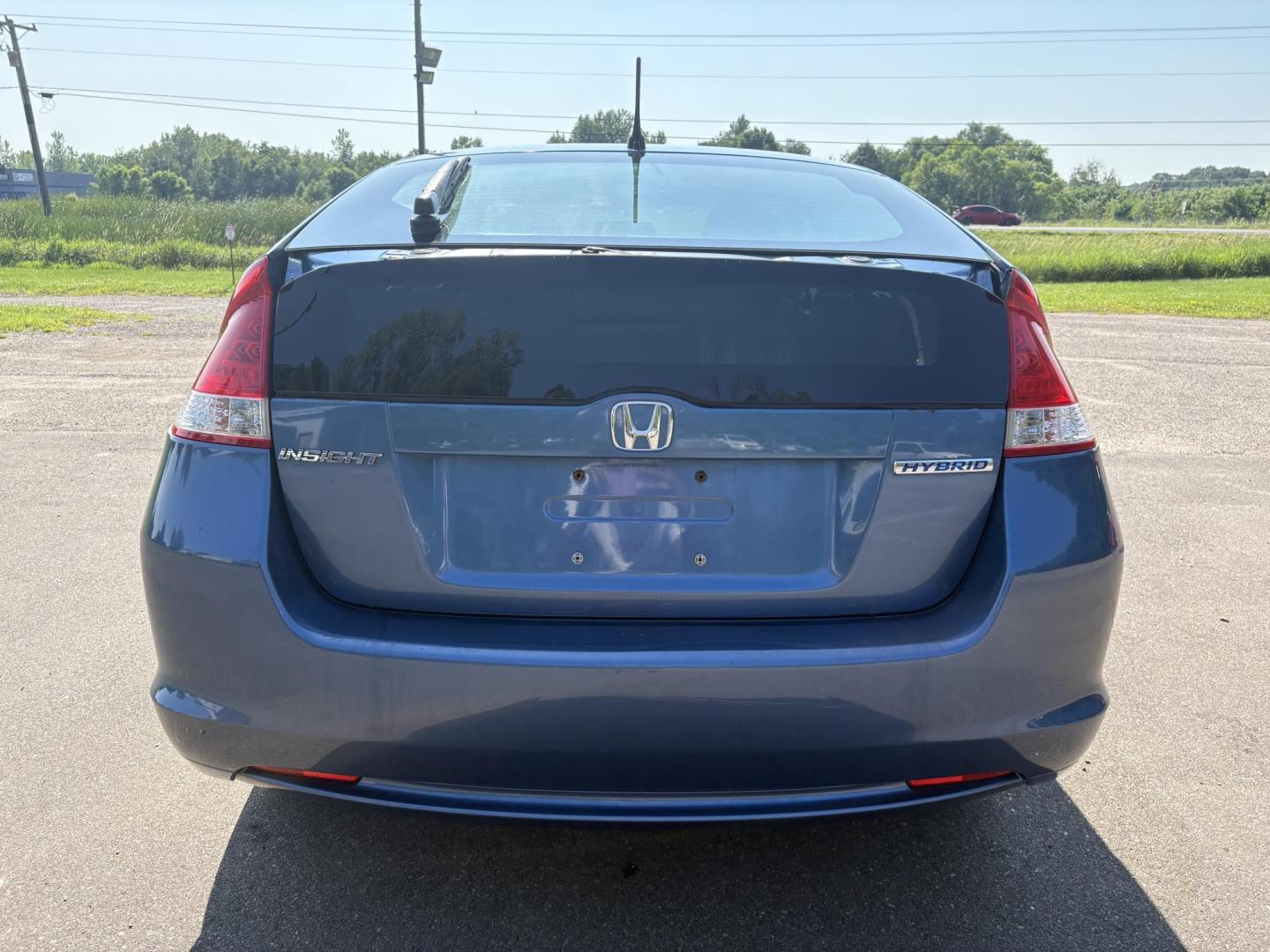 2010 Blue Honda Insight LX (JHMZE2H58AS) with an 1.3L L4 SOHC 8V HYBRID engine, Continuously Variable Transmisson transmission, located at 17255 hwy 65 NE, Ham Lake, MN, 55304, 0.000000, 0.000000 - Photo#3