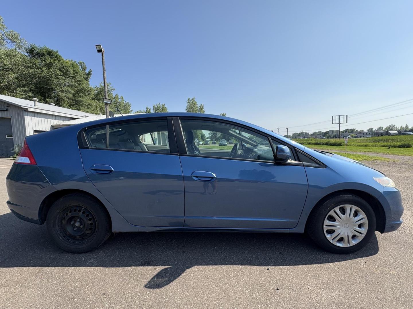 2010 Blue Honda Insight LX (JHMZE2H58AS) with an 1.3L L4 SOHC 8V HYBRID engine, Continuously Variable Transmisson transmission, located at 17255 hwy 65 NE, Ham Lake, MN, 55304, 0.000000, 0.000000 - Photo#5
