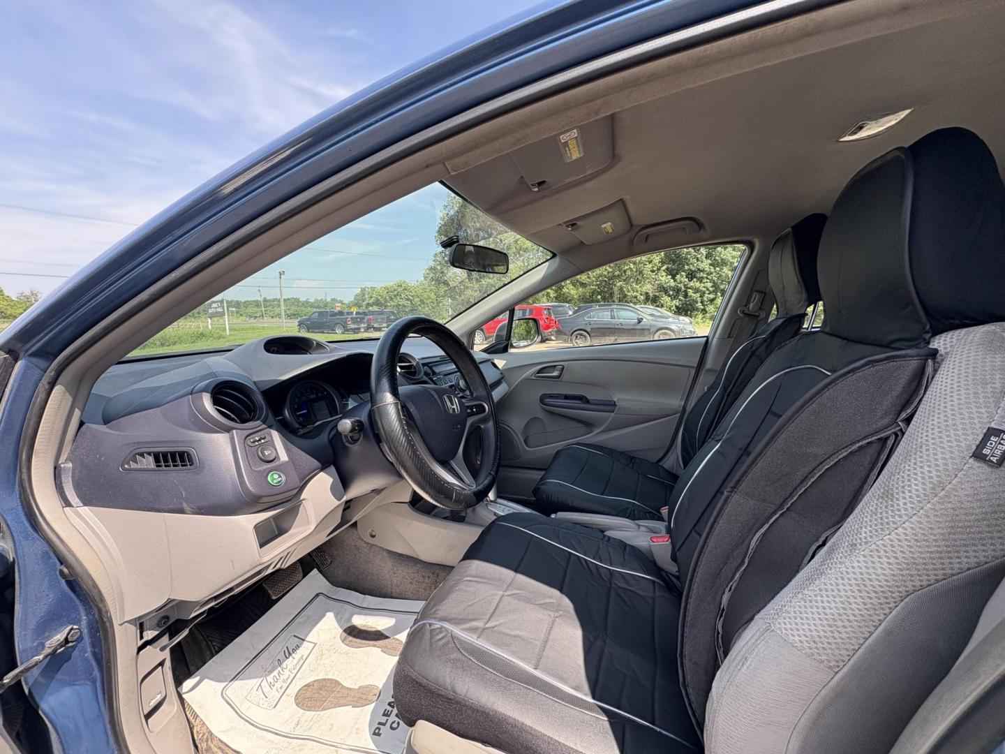 2010 Blue Honda Insight LX (JHMZE2H58AS) with an 1.3L L4 SOHC 8V HYBRID engine, Continuously Variable Transmisson transmission, located at 17255 hwy 65 NE, Ham Lake, MN, 55304, 0.000000, 0.000000 - Photo#9