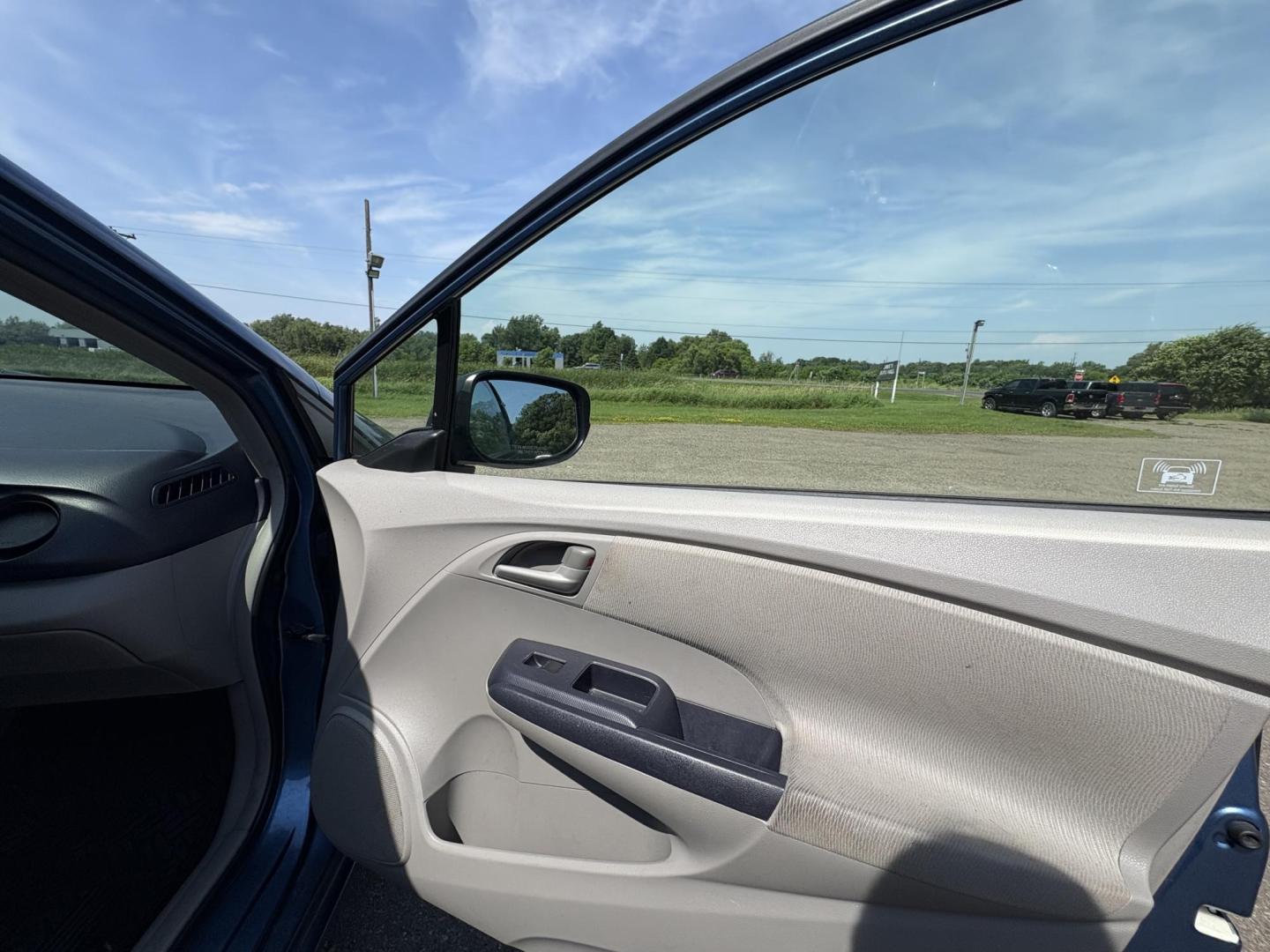 2010 Blue Honda Insight LX (JHMZE2H58AS) with an 1.3L L4 SOHC 8V HYBRID engine, Continuously Variable Transmisson transmission, located at 17255 hwy 65 NE, Ham Lake, MN, 55304, 0.000000, 0.000000 - Photo#14