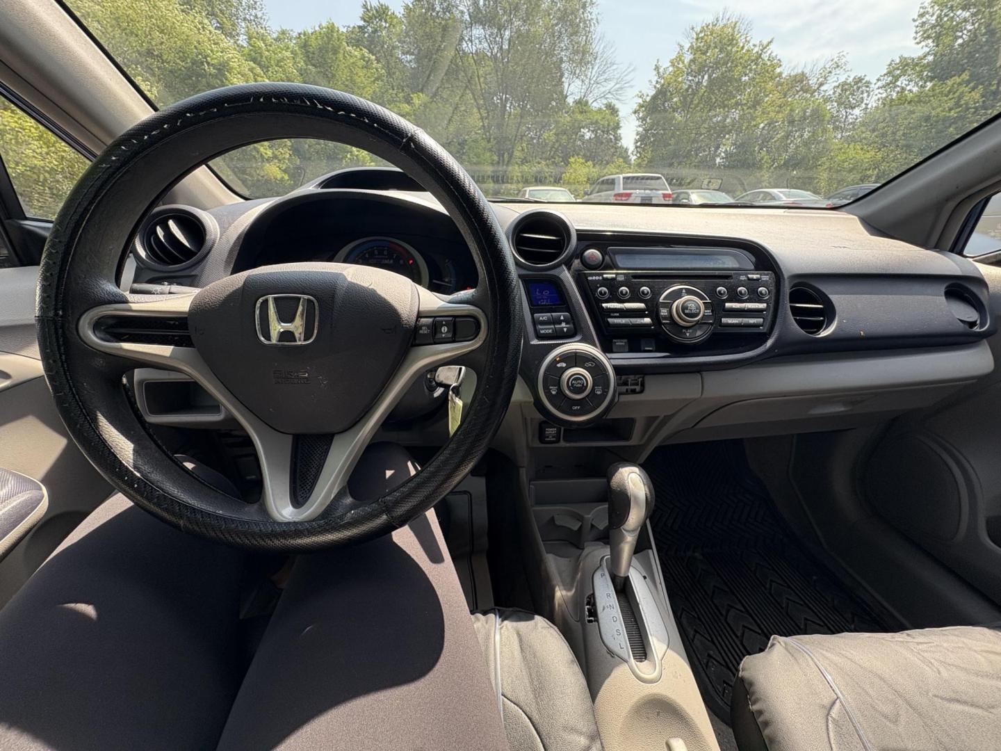 2010 Blue Honda Insight LX (JHMZE2H58AS) with an 1.3L L4 SOHC 8V HYBRID engine, Continuously Variable Transmisson transmission, located at 17255 hwy 65 NE, Ham Lake, MN, 55304, 0.000000, 0.000000 - Photo#16