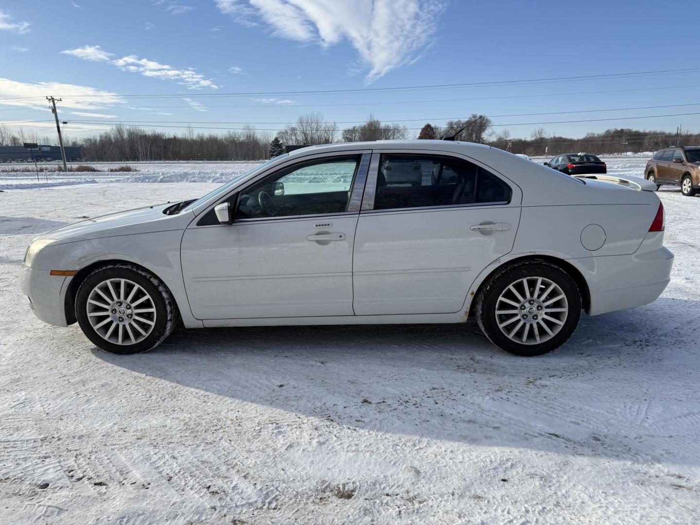 2009 White Mercury Milan V6 Premier (3MEHM08139R) with an 3.0L V6 DOHC 24V engine, 6-Speed Automatic transmission, located at 17255 hwy 65 NE, Ham Lake, MN, 55304, 0.000000, 0.000000 - Photo#1